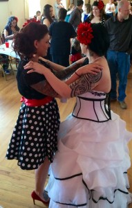 Red & Black wedding theme. White wedding dress with black trim