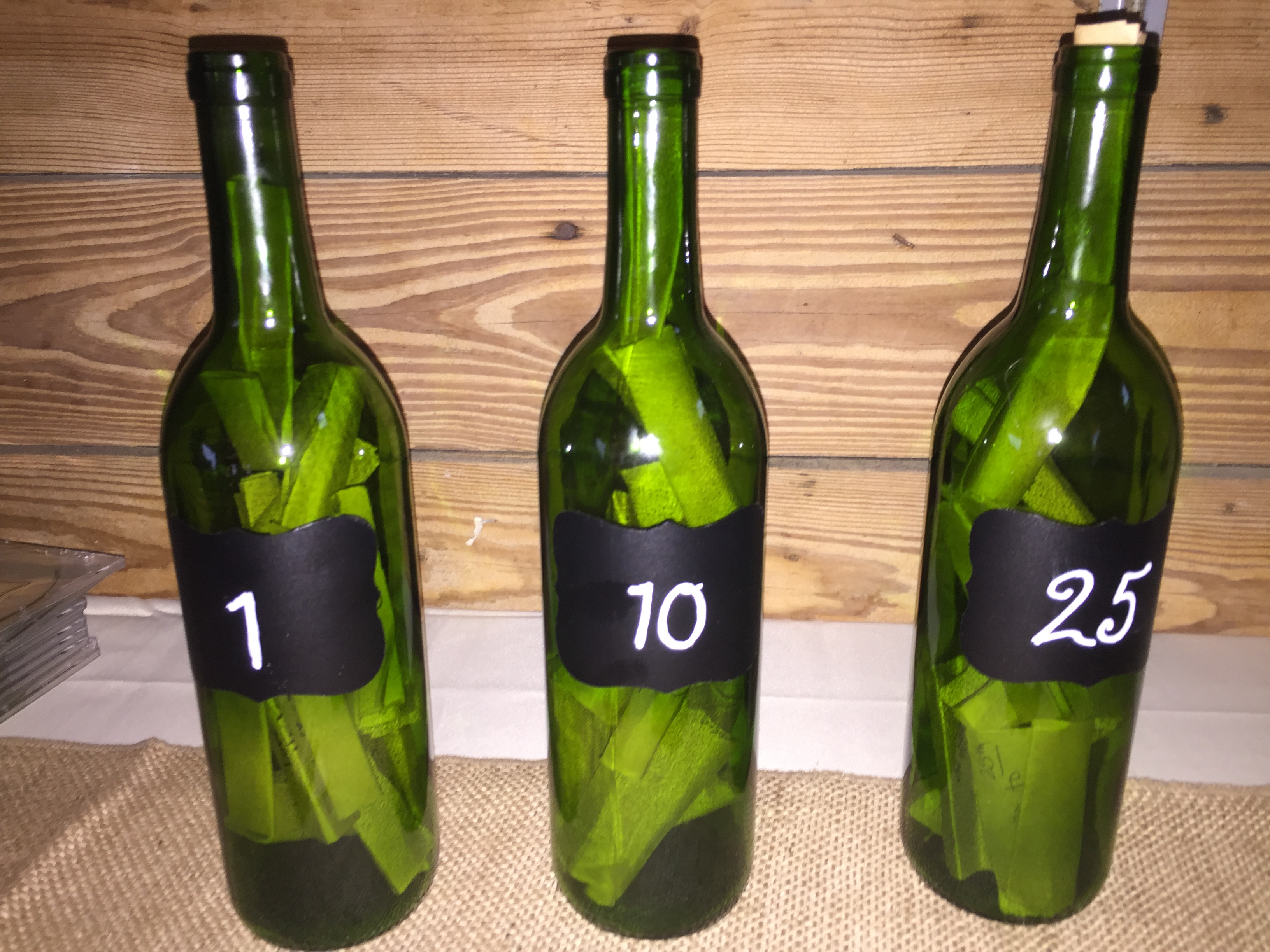 Put numbers on the bottles to signify the year of the anniversary